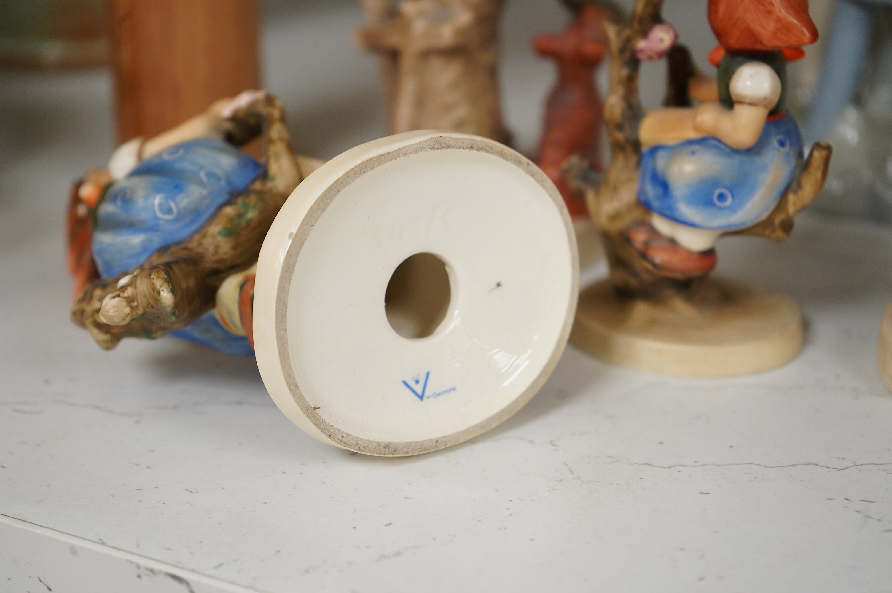 Six various Goebel figures and a Lladro figure, 24cm high